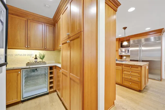 a view of a dining room with furniture and a chandelier