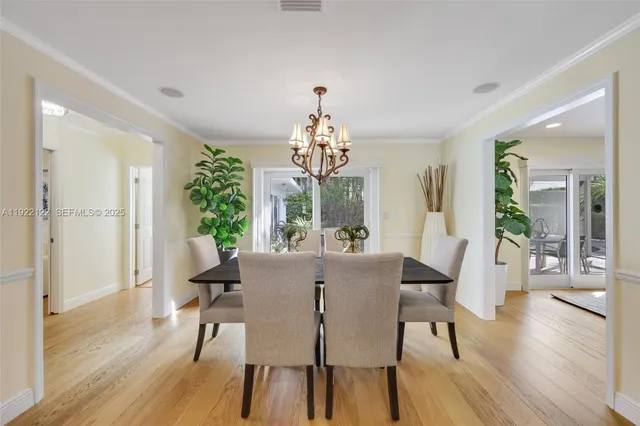 a living room with furniture and a view of kitchen
