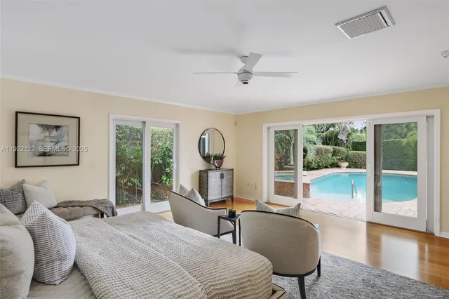 a spacious bathroom with a double vanity sink a mirror and a shower