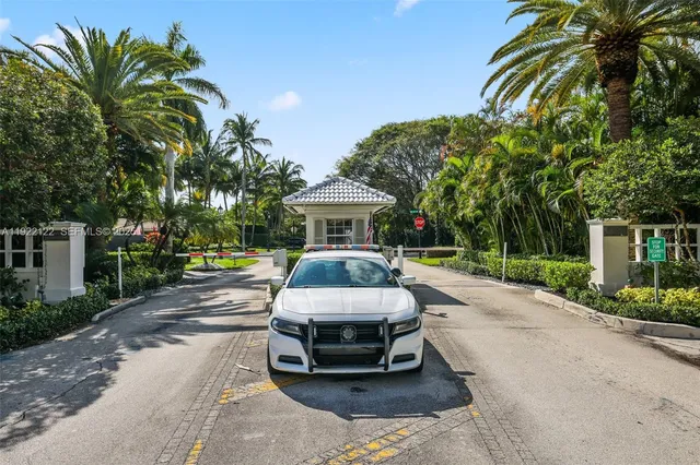 a view of a patio with a dining table and chairs with wooden floor
