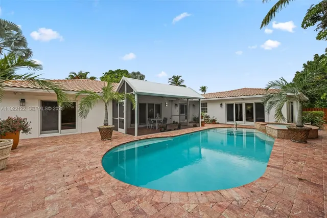 an aerial view of a house with a yard and garden