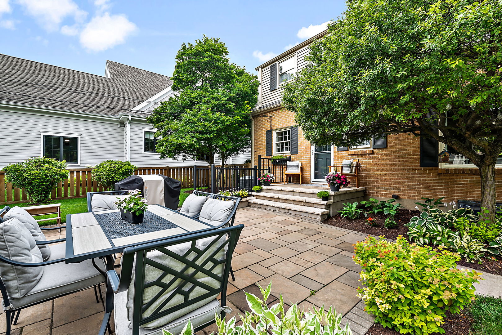 1202 South 4th Street St. Charles, IL 60174 - Photo 17 of 22 a view of a patio with table and chairs and potted plants