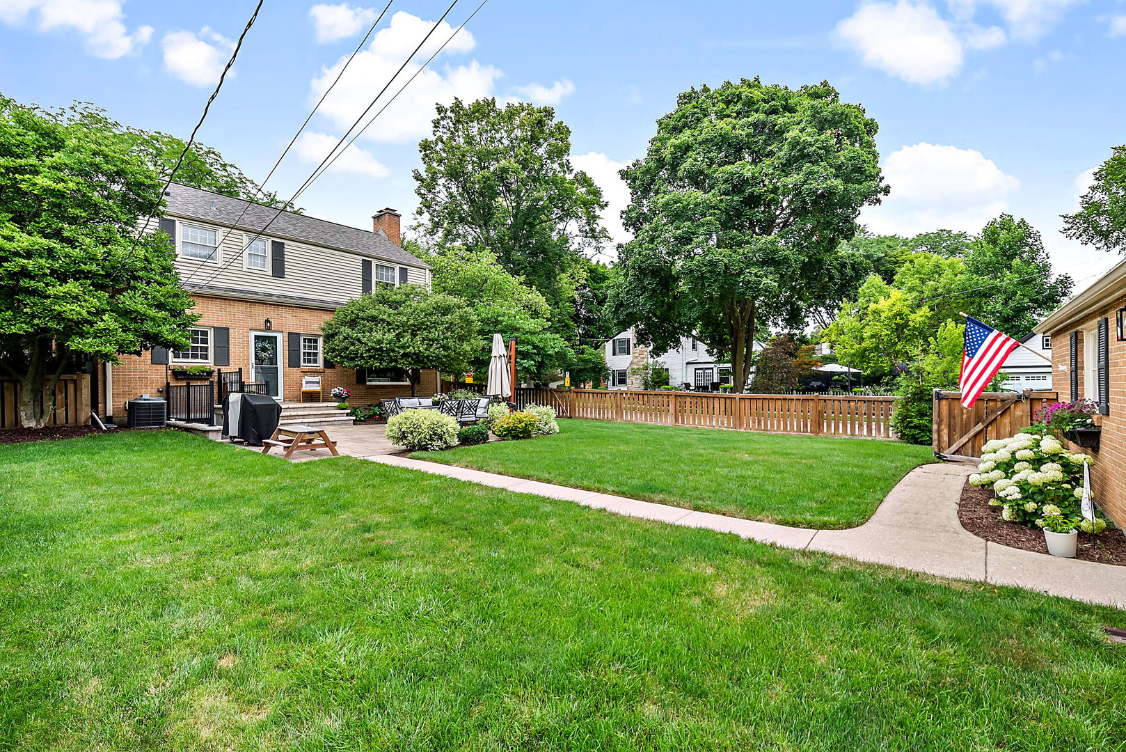 1202 South 4th Street St. Charles, IL 60174 - Photo 19 of 22 a view of a house with a big yard plants and large trees