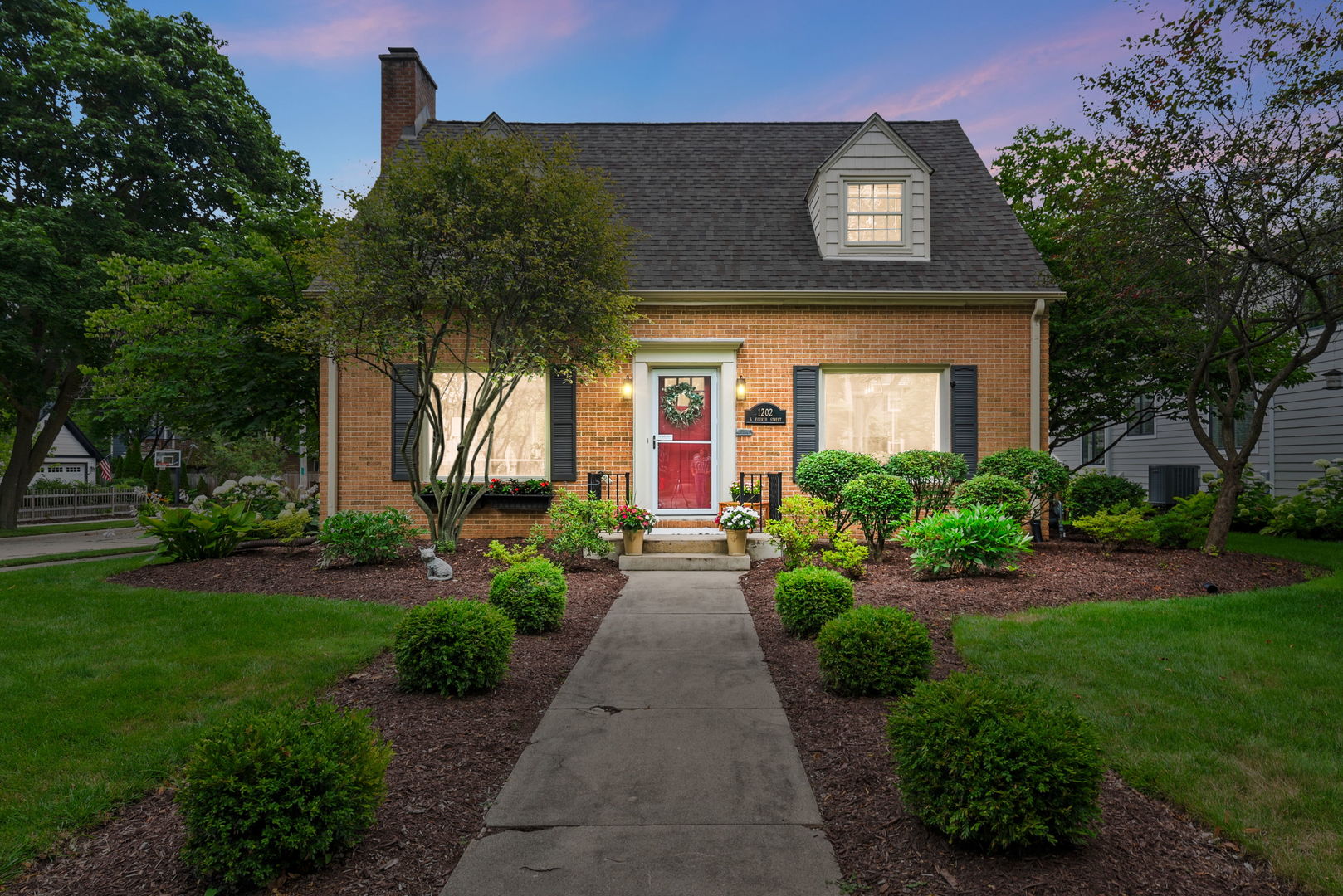 1202 South 4th Street St. Charles, IL 60174 - Photo 22 of 22 a front view of a house with garden