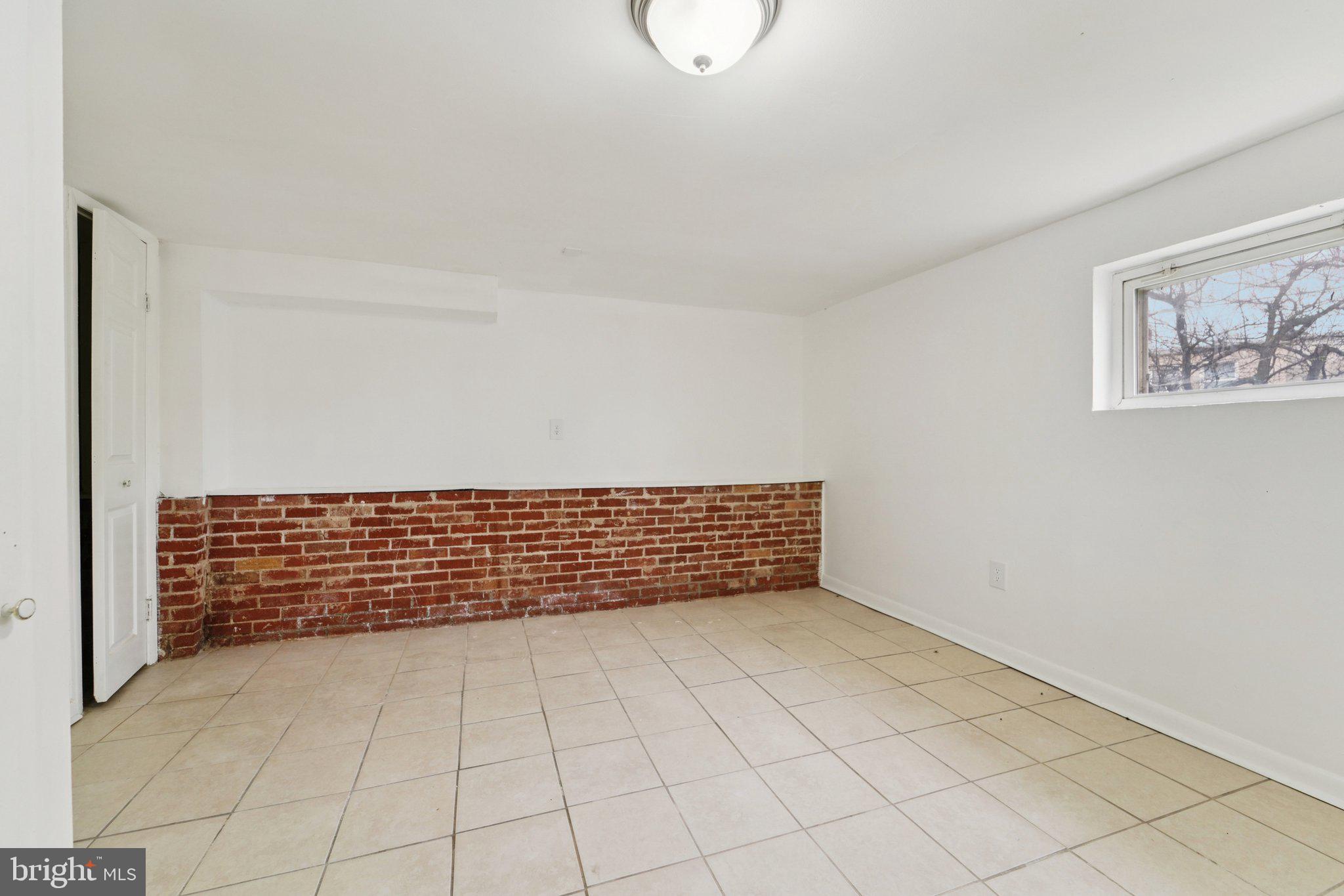 800 Stoll Street Baltimore, MD 21225 - Photo 12 of 24 a view of an empty room and wooden floor