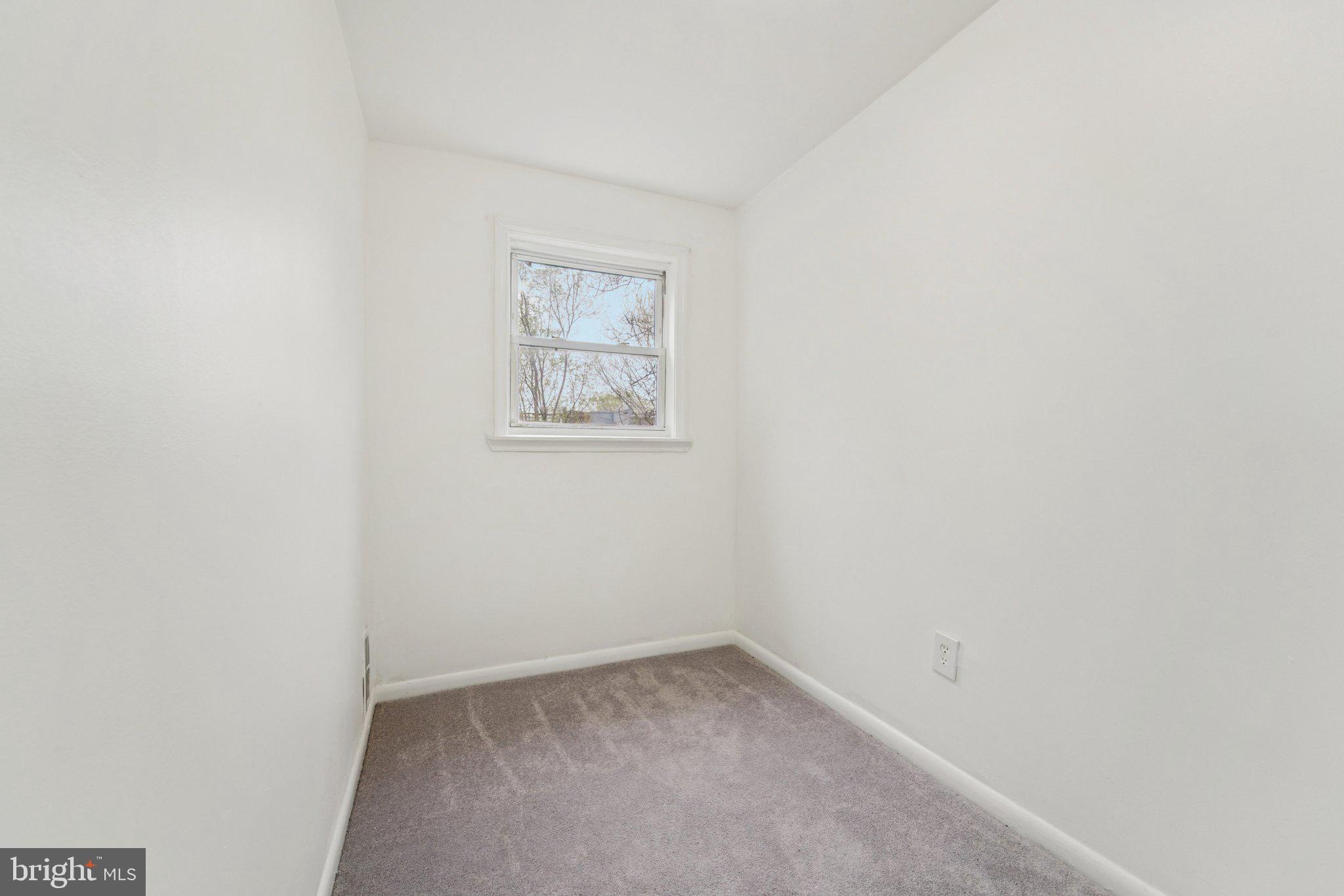 800 Stoll Street Baltimore, MD 21225 - Photo 17 of 24 a view of an empty room with a window