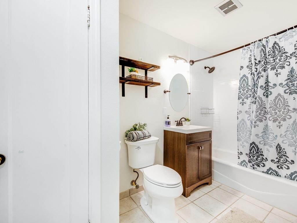 203 Doris Drive Pleasant Hill, CA 94523 - Photo 12 of 22 a white toilet sitting next to a bathroom sink