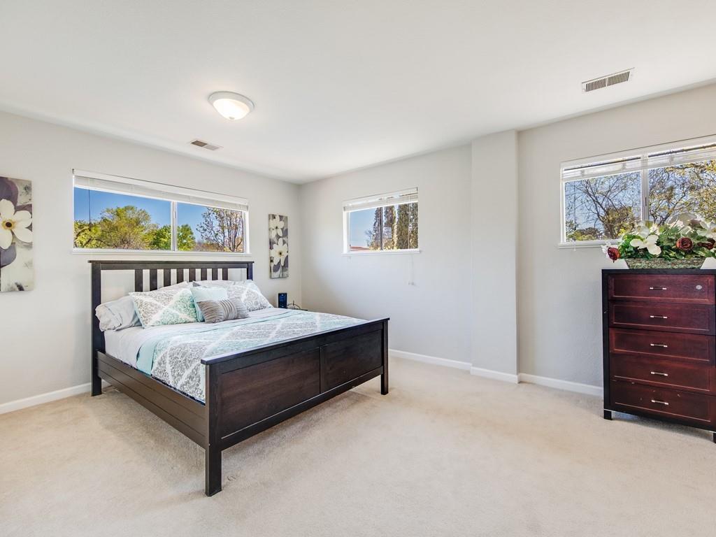 203 Doris Drive Pleasant Hill, CA 94523 - Photo 13 of 22 a bedroom with a bed and painting on the wall