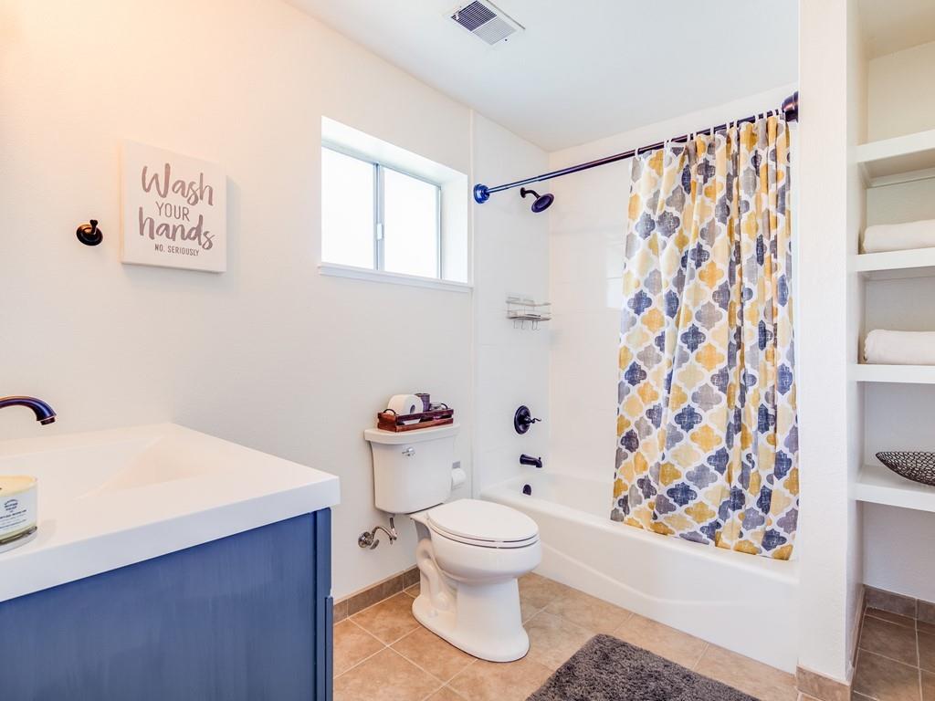 203 Doris Drive Pleasant Hill, CA 94523 - Photo 14 of 22 a white toilet sitting next to a bathroom sink