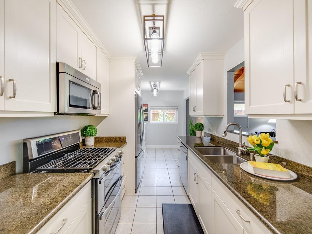 203 Doris Drive Pleasant Hill, CA 94523 - Photo 4 of 22 a kitchen with stainless steel appliances granite countertop a sink stove and cabinets