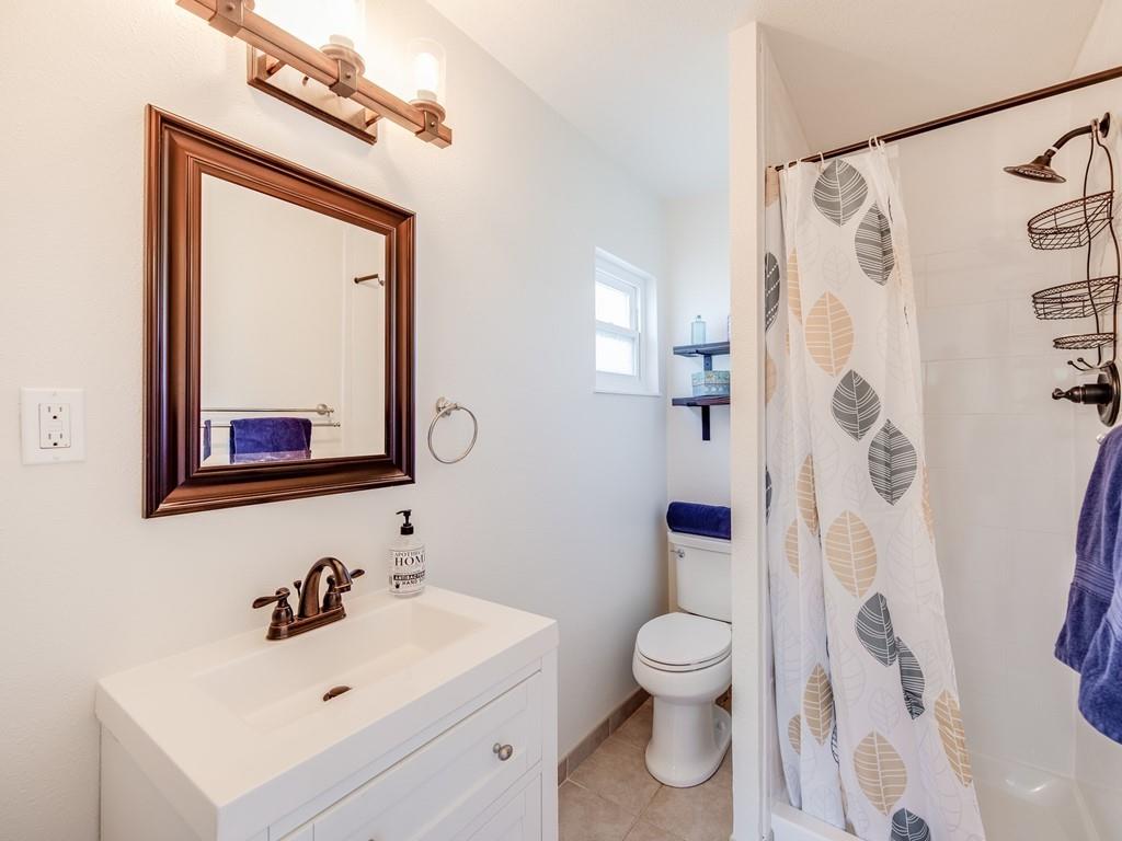 203 Doris Drive Pleasant Hill, CA 94523 - Photo 8 of 22 a bathroom with a toilet sink and mirror