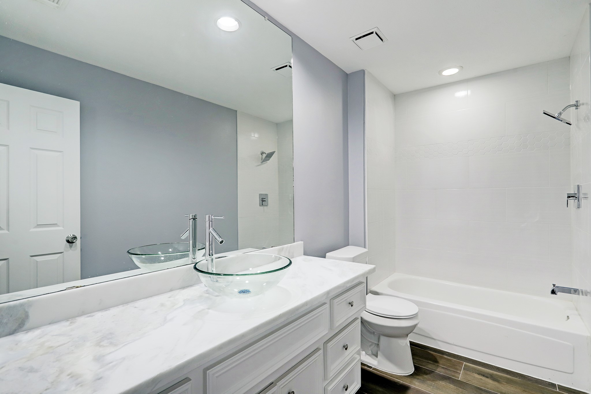 7403 Manor Bridge Court Houston, TX 77095 - Photo 7 of 11 a bathroom with a granite countertop sink a toilet and shower
