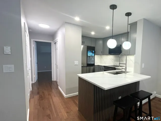 a kitchen with a table and chairs in it