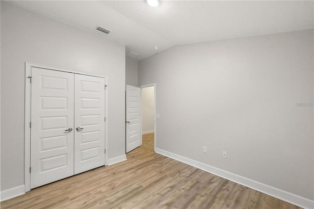 14429 Potterton Circle Hudson, FL 34667 - Photo 15 of 36 wooden floor in an empty room