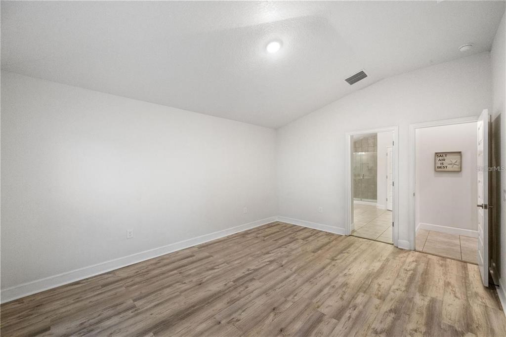 14429 Potterton Circle Hudson, FL 34667 - Photo 21 of 36 wooden floor in an empty room