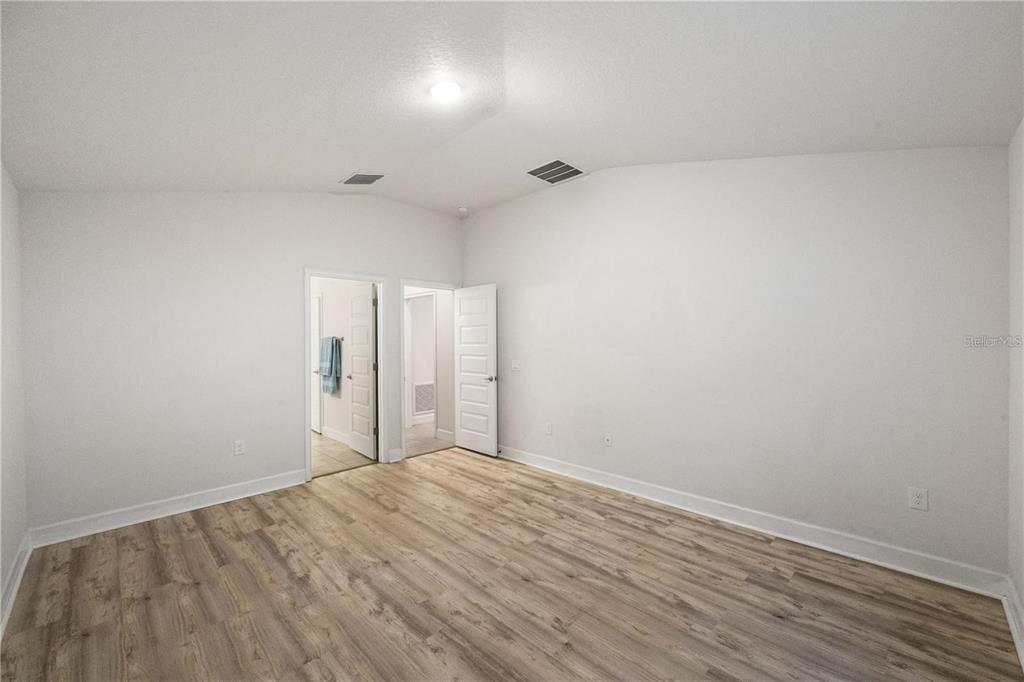14429 Potterton Circle Hudson, FL 34667 - Photo 23 of 36 a view of a room with wooden floor