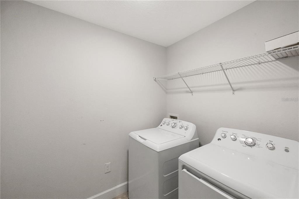 14429 Potterton Circle Hudson, FL 34667 - Photo 25 of 36 a utility room with dryer and washer