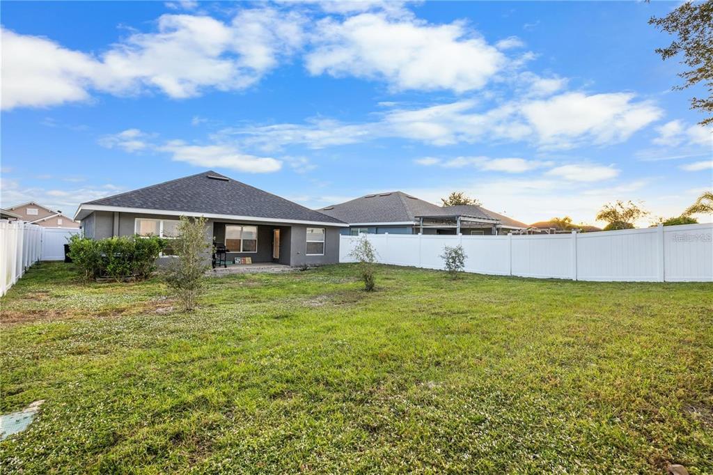 14429 Potterton Circle Hudson, FL 34667 - Photo 29 of 36 a view of a house with a yard