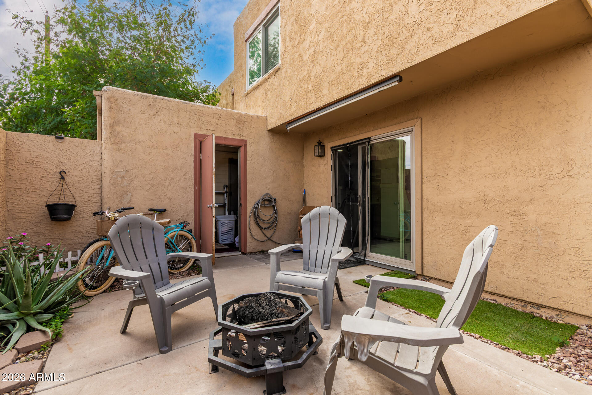 948 South Alma School Road, Unit 128 Mesa, AZ 85210 - Photo 2 of 18 a view of a chairs and tables in patio