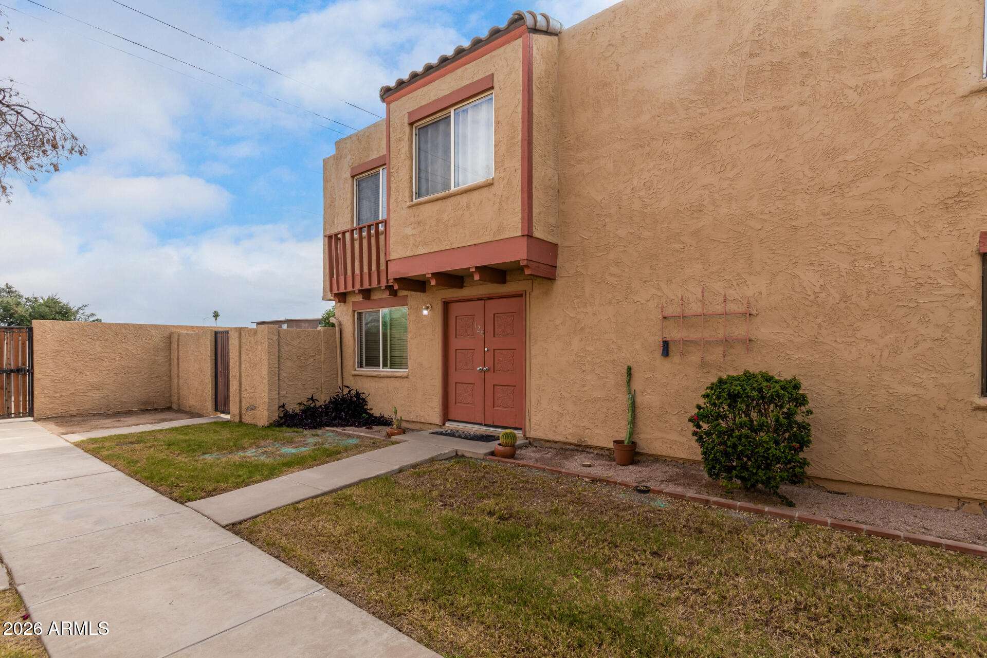 948 South Alma School Road, Unit 128 Mesa, AZ 85210 - Photo 4 of 18 a view of a house with a yard