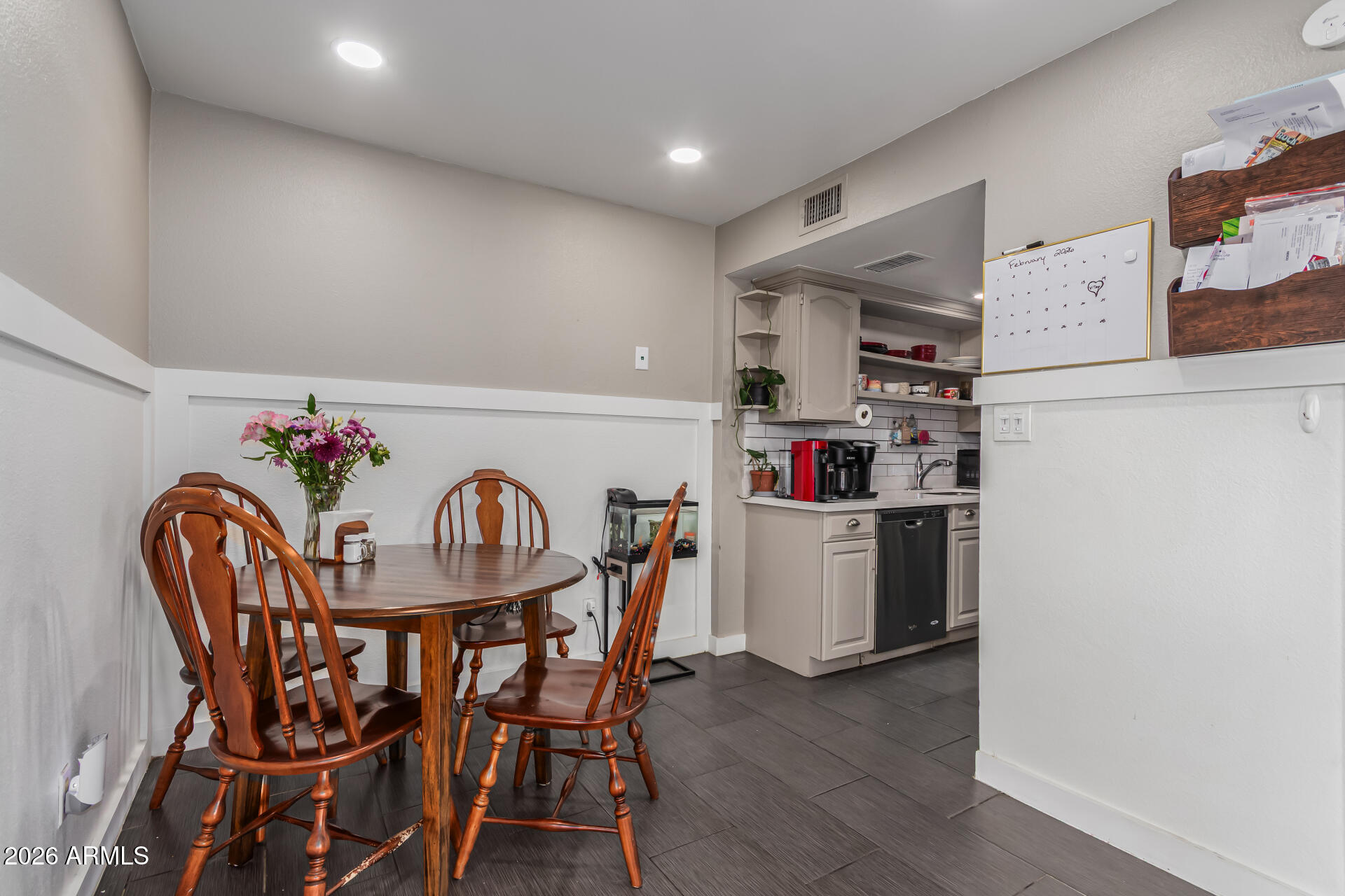 948 South Alma School Road, Unit 128 Mesa, AZ 85210 - Photo 8 of 18 a table and chairs in a kitchen