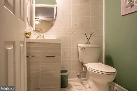 a bathroom with a toilet sink and shower