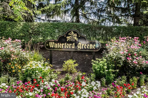 a view of sign board and green space