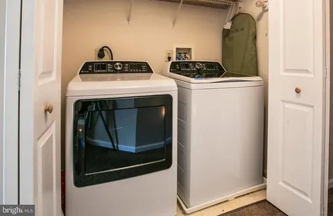 a stove top oven sitting inside of a kitchen