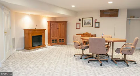 a view of a livingroom with workspace and a couch