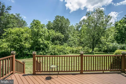 a view of balcony with wooden floor