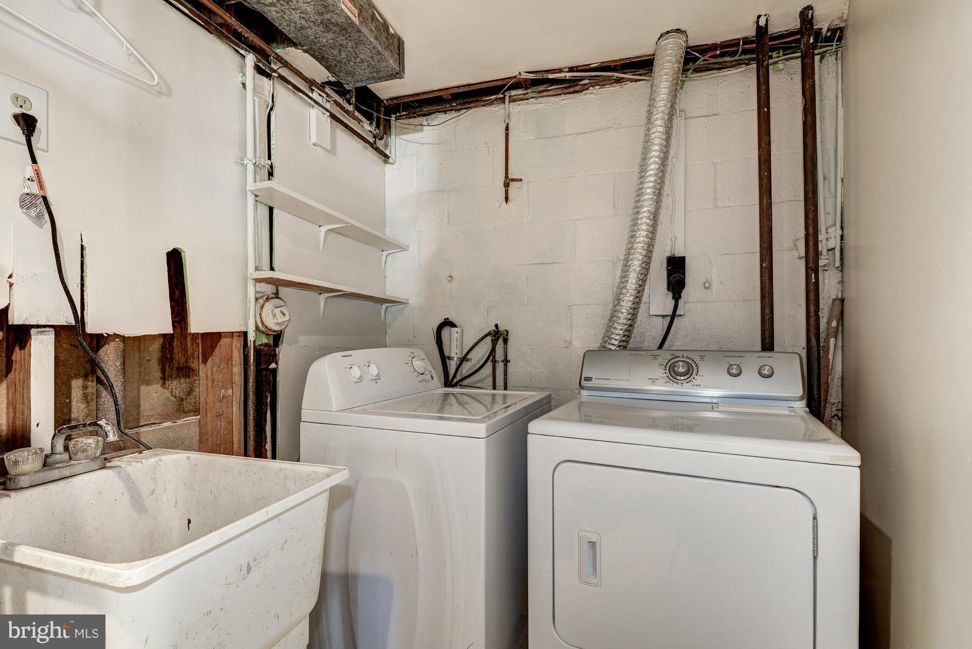 12004 Cook Court Silver Spring, MD 20902 - Photo 22 of 28 a bathroom with a sink a toilet and a tub