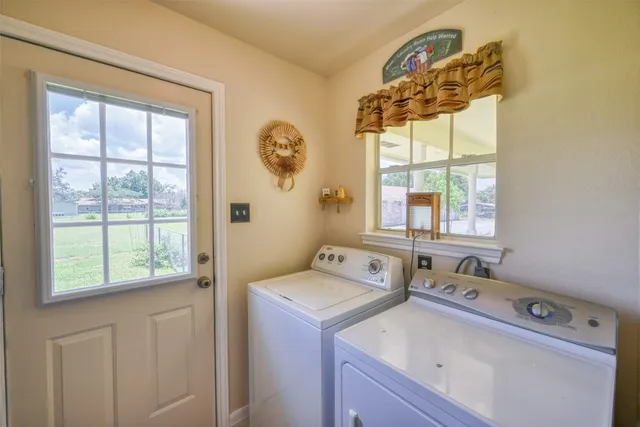 a utility room with a window dryer and washer