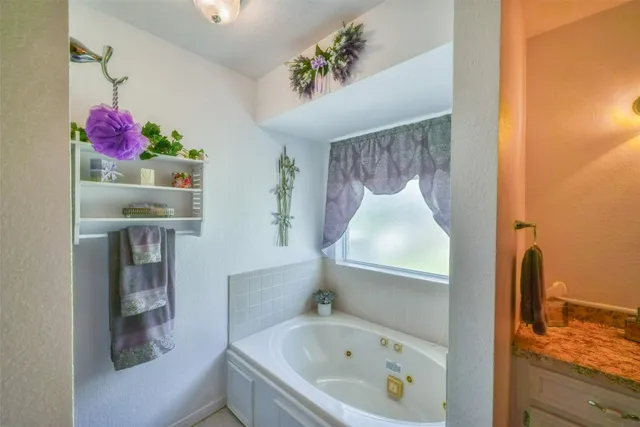 a bathroom with a bathtub and a shower