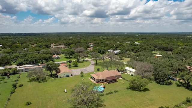 a view of a lake with houses in all around