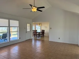 a view of a livingroom with a dining table and chair