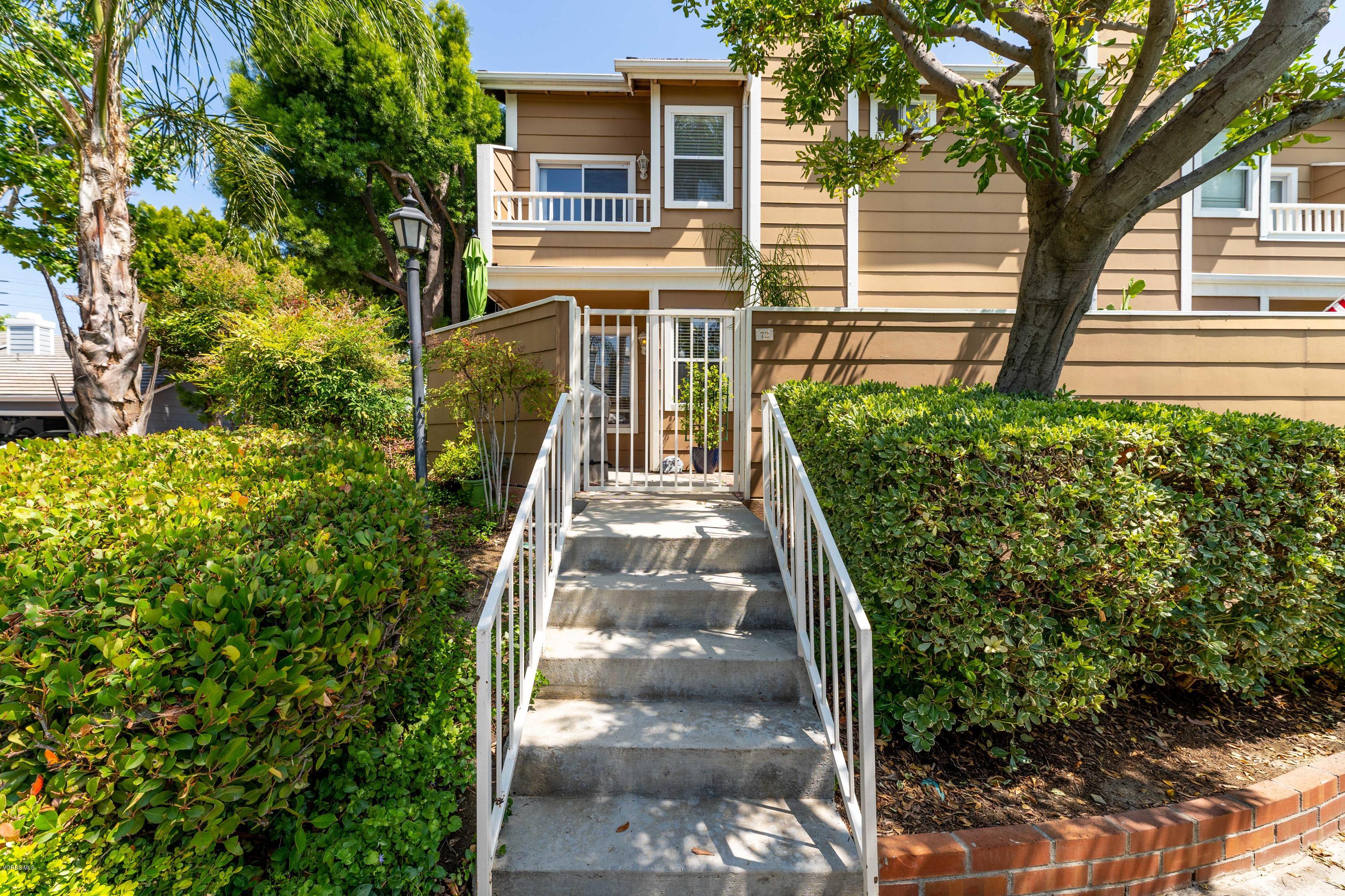 3966 Cochran Street, Unit 72 Simi Valley, CA 93063 - Photo 2 of 26 a view of a house with a yard