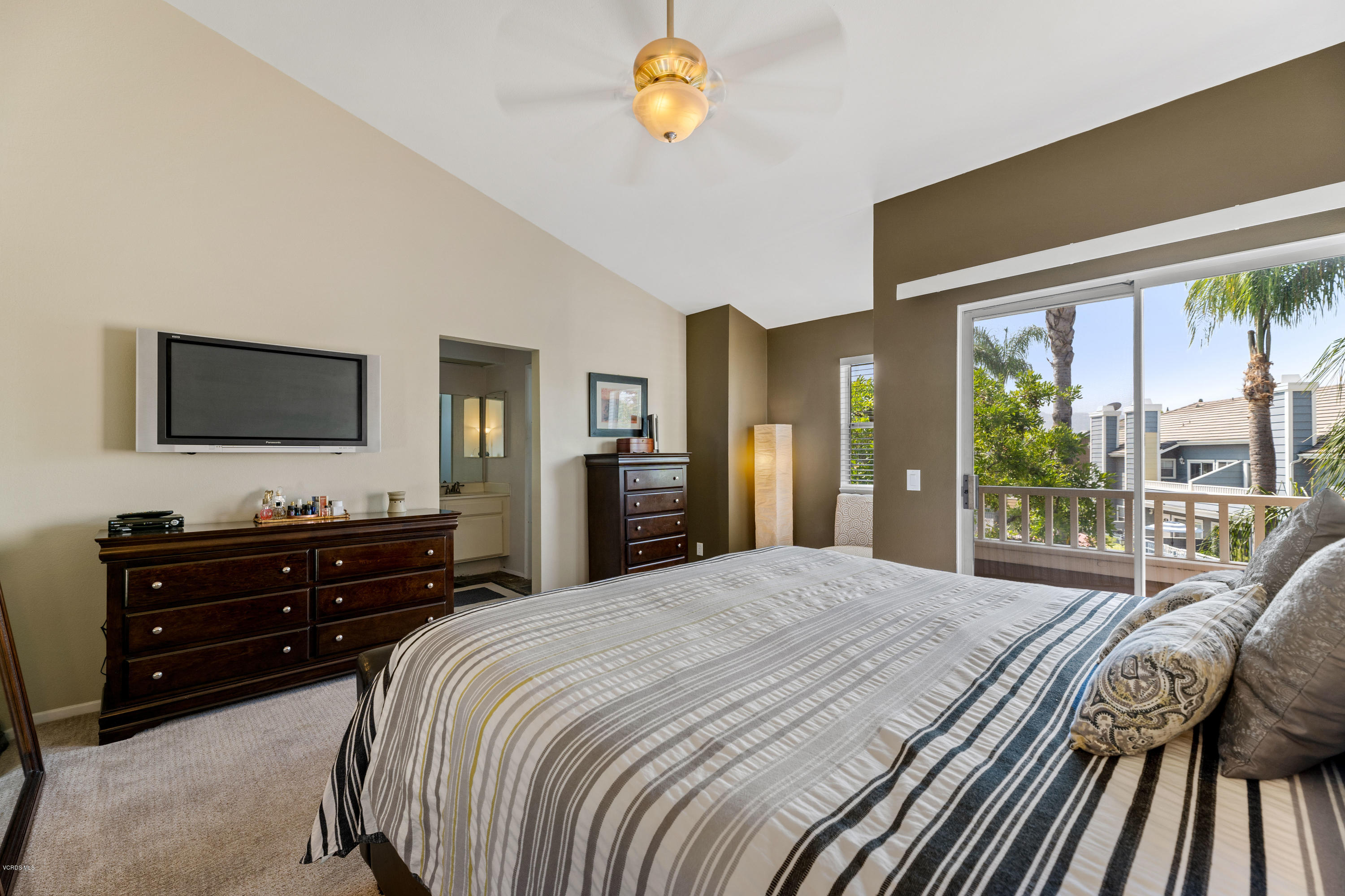 3966 Cochran Street, Unit 72 Simi Valley, CA 93063 - Photo 15 of 26 a bedroom with a bed and a flat tv screen on dresser