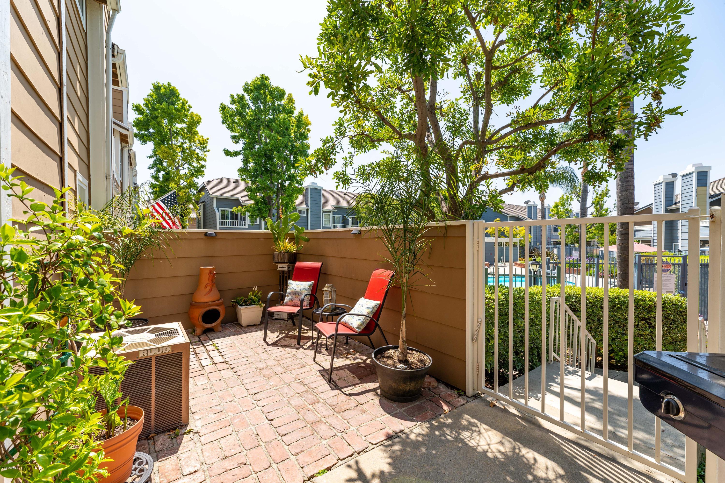 3966 Cochran Street, Unit 72 Simi Valley, CA 93063 - Photo 3 of 26 a view of outdoor space with seating area and trees around