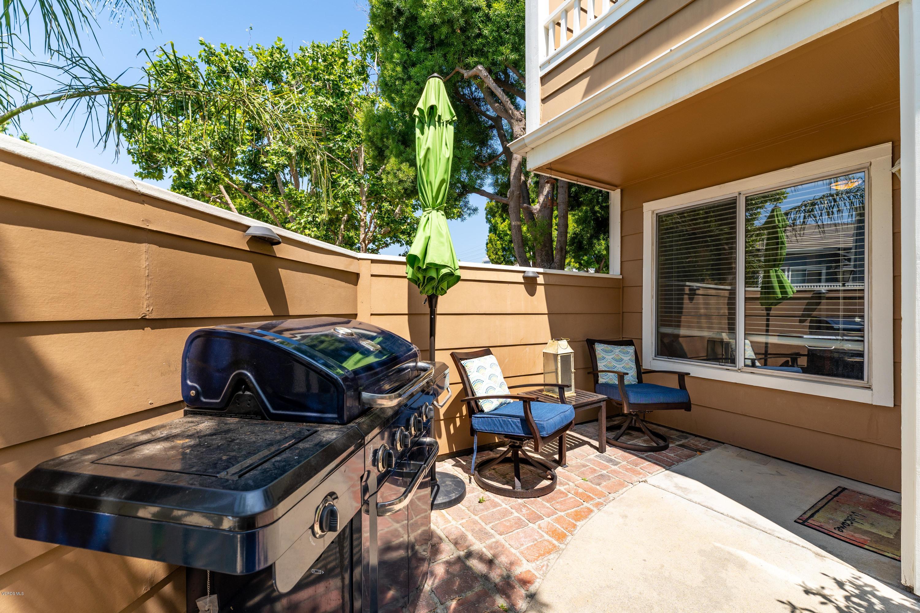 3966 Cochran Street, Unit 72 Simi Valley, CA 93063 - Photo 22 of 26 a view of backyard with wheel chair and potted plants