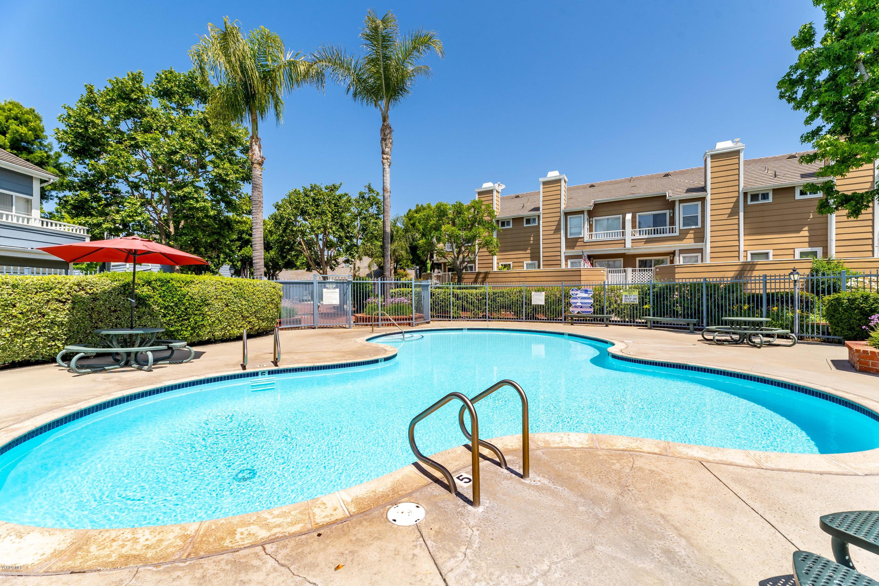 3966 Cochran Street, Unit 72 Simi Valley, CA 93063 - Photo 23 of 26 a swimming pool with outdoor seating and yard