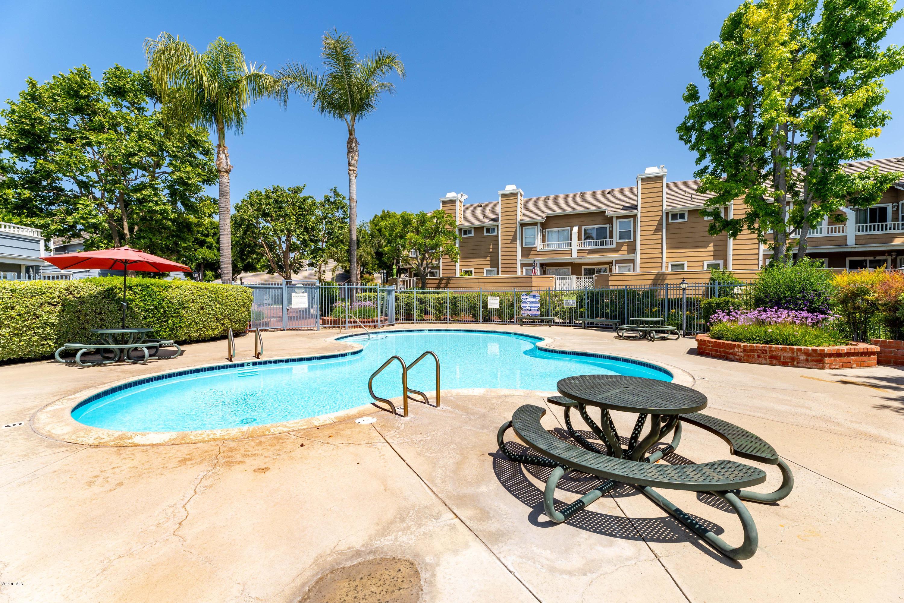 3966 Cochran Street, Unit 72 Simi Valley, CA 93063 - Photo 25 of 26 a swimming pool with outdoor seating and yard