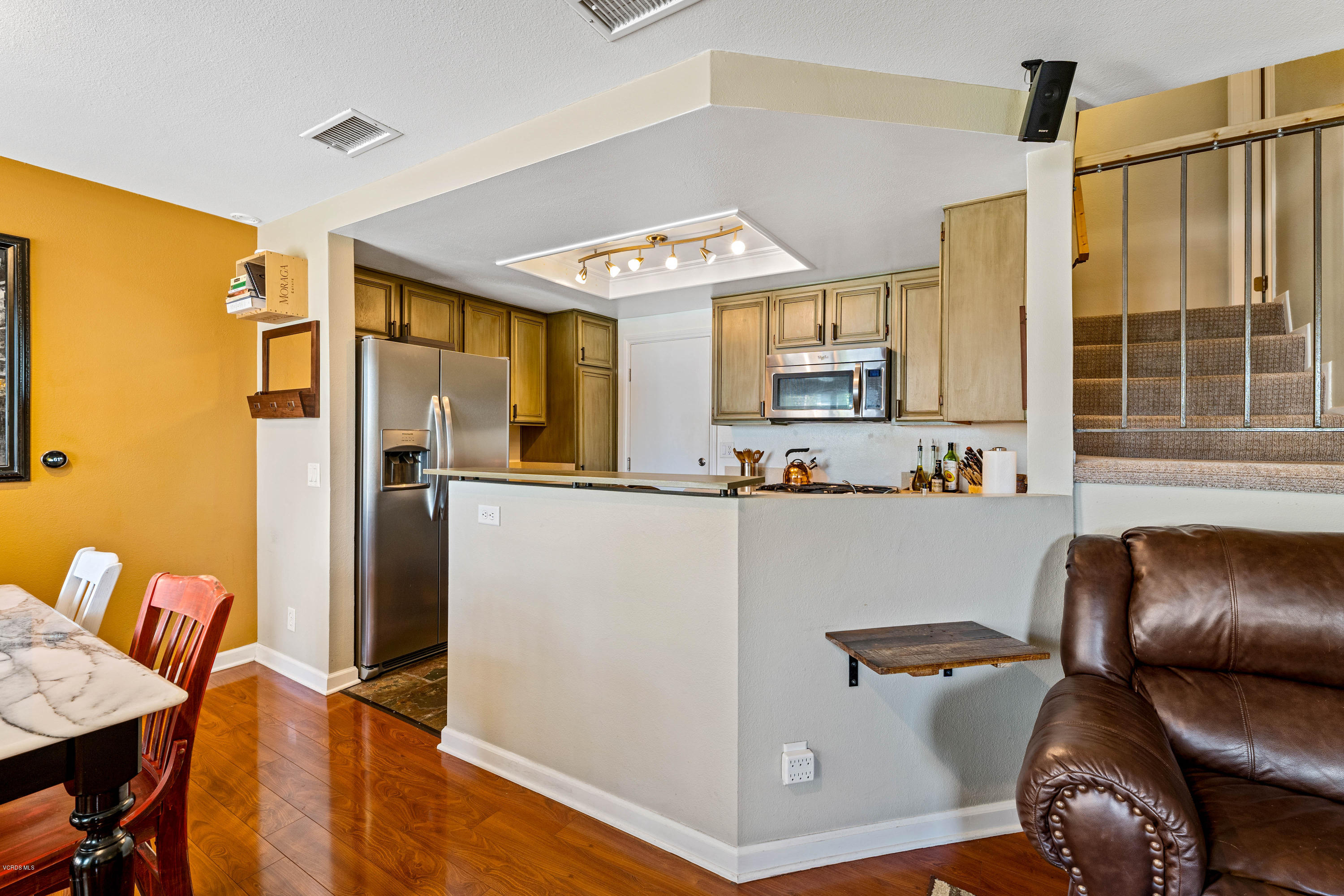 3966 Cochran Street, Unit 72 Simi Valley, CA 93063 - Photo 10 of 26 a view of kitchen with stainless steel appliances granite countertop furniture and a refrigerator