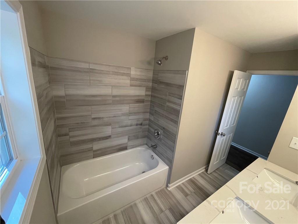 1601 Rushing Street Monroe, NC 28112 - Photo 14 of 21 a bathroom with a bathtub