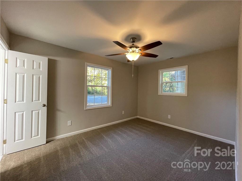 1601 Rushing Street Monroe, NC 28112 - Photo 17 of 21 an empty room with windows and fan