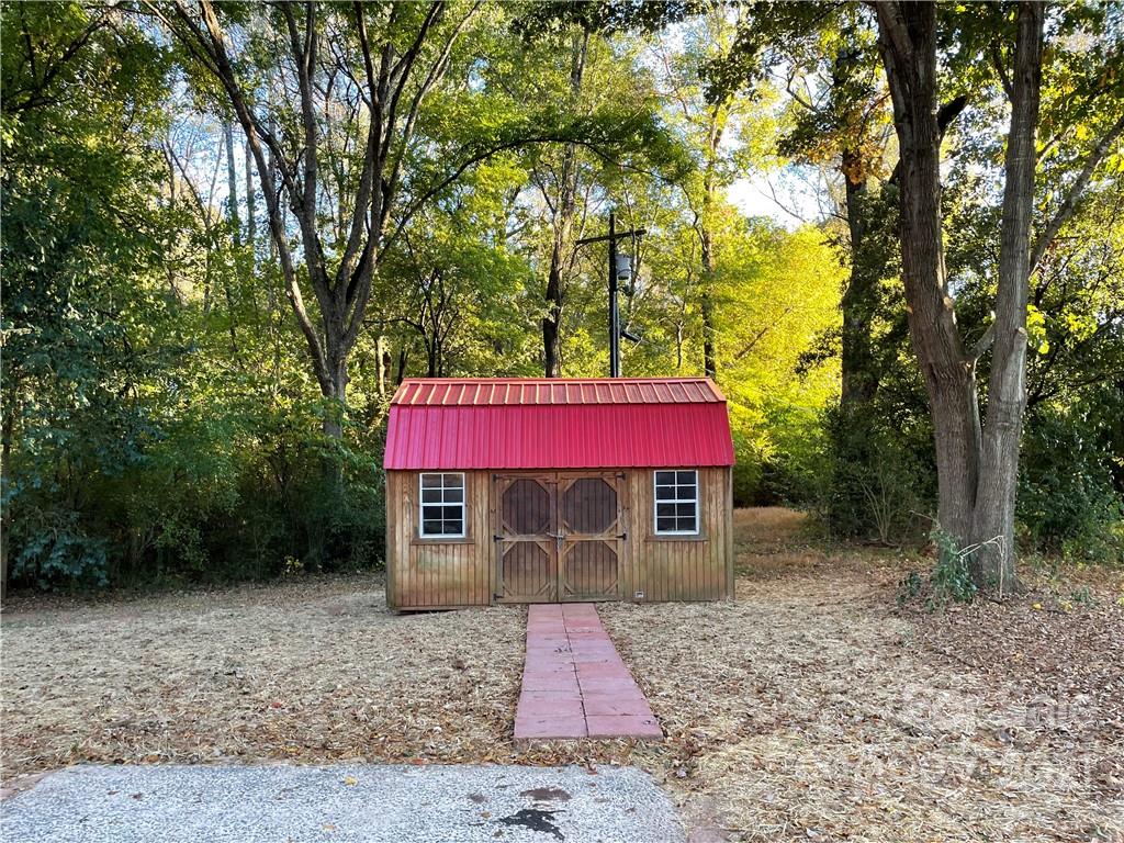 1601 Rushing Street Monroe, NC 28112 - Photo 21 of 21 a front view of a house with a yard and tree