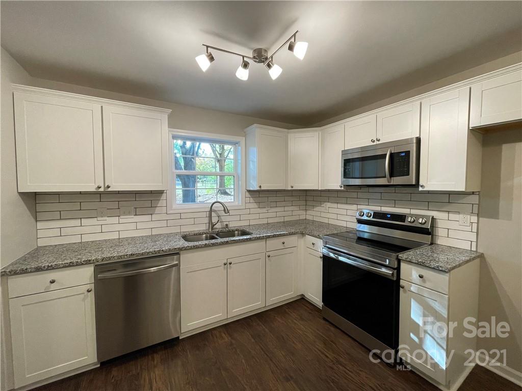 1601 Rushing Street Monroe, NC 28112 - Photo 8 of 21 a kitchen with a sink stove and microwave