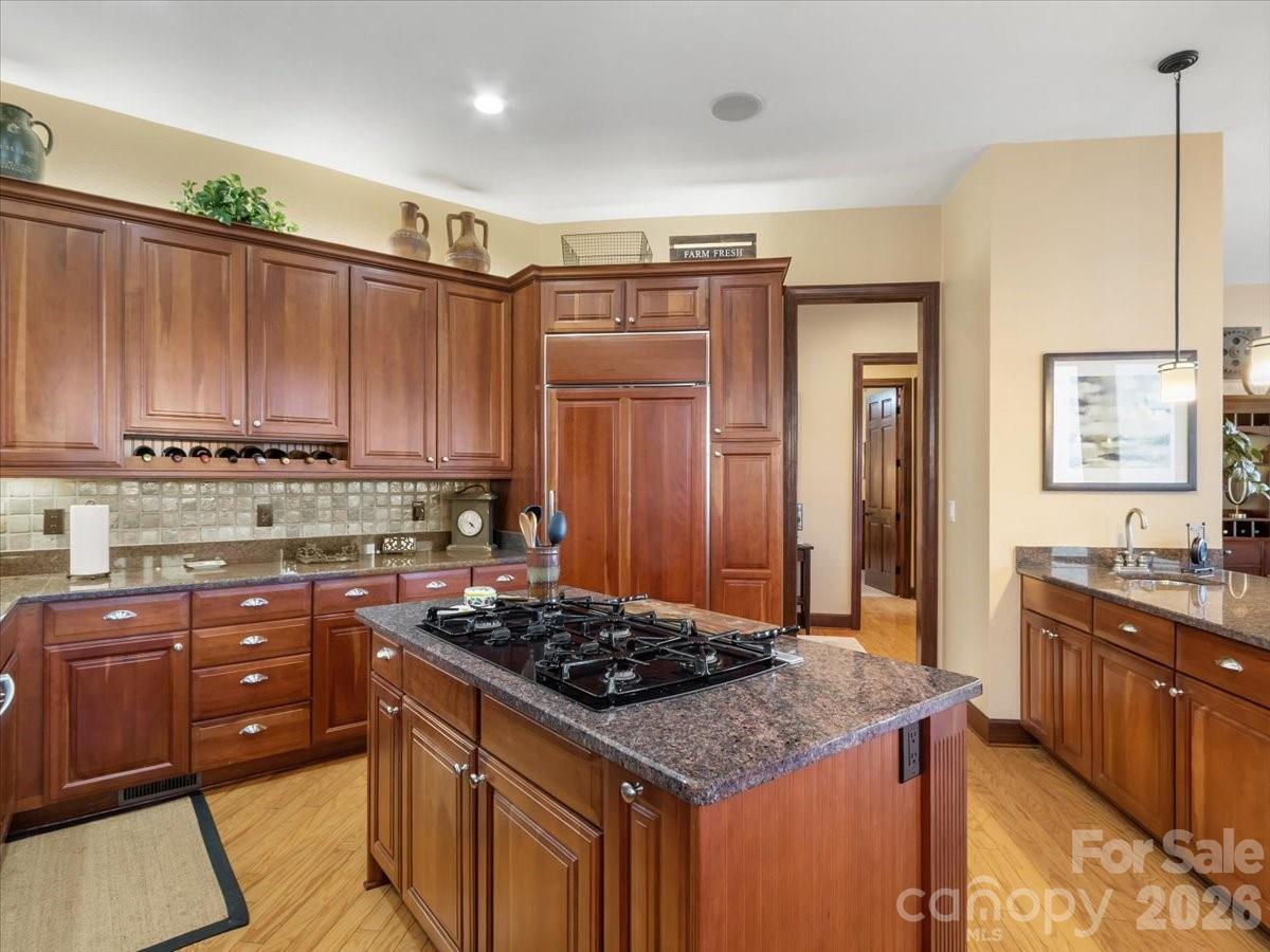 600 Andrew Banks Road, Unit D4 Burnsville, NC 28714 - Photo 12 of 42 a kitchen with stainless steel appliances granite countertop a stove a sink and a refrigerator