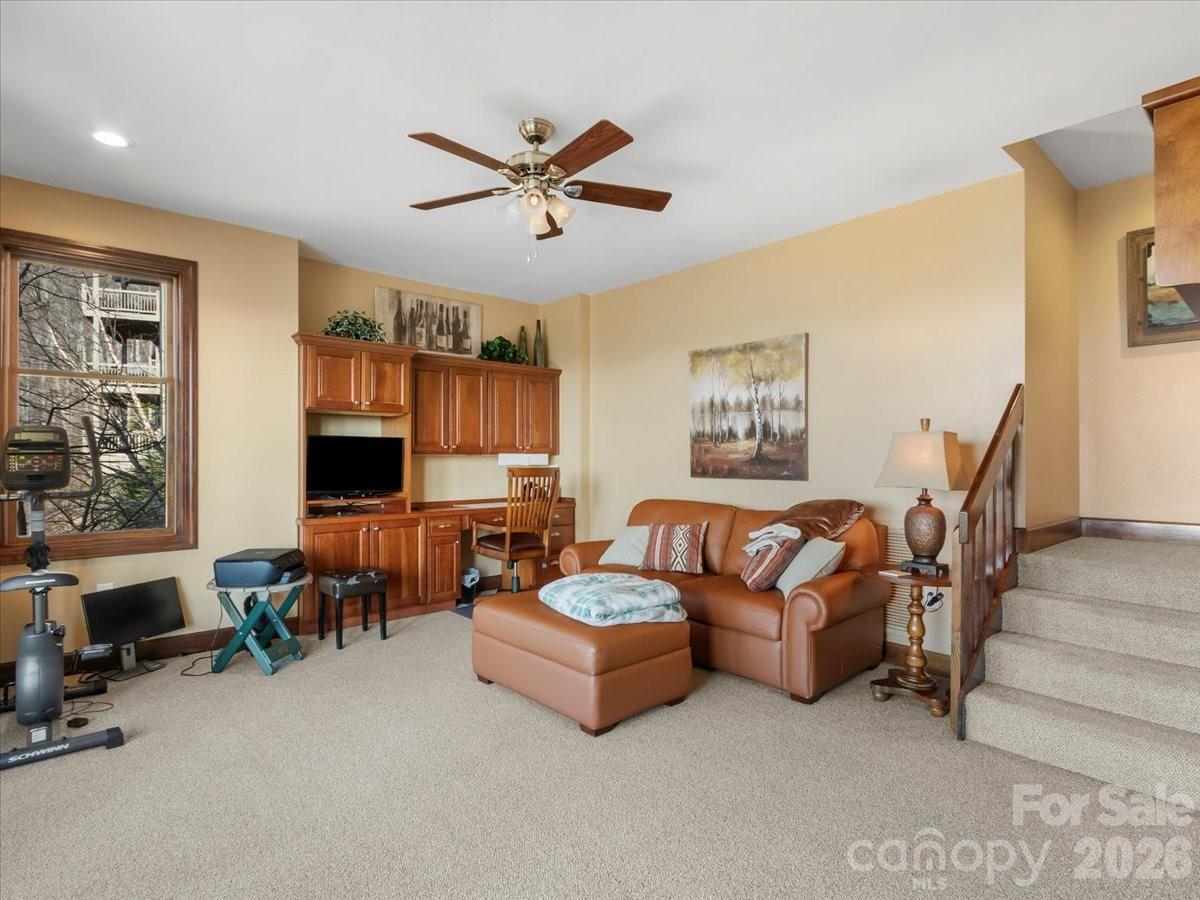 600 Andrew Banks Road, Unit D4 Burnsville, NC 28714 - Photo 30 of 42 a living room with furniture and a flat screen tv