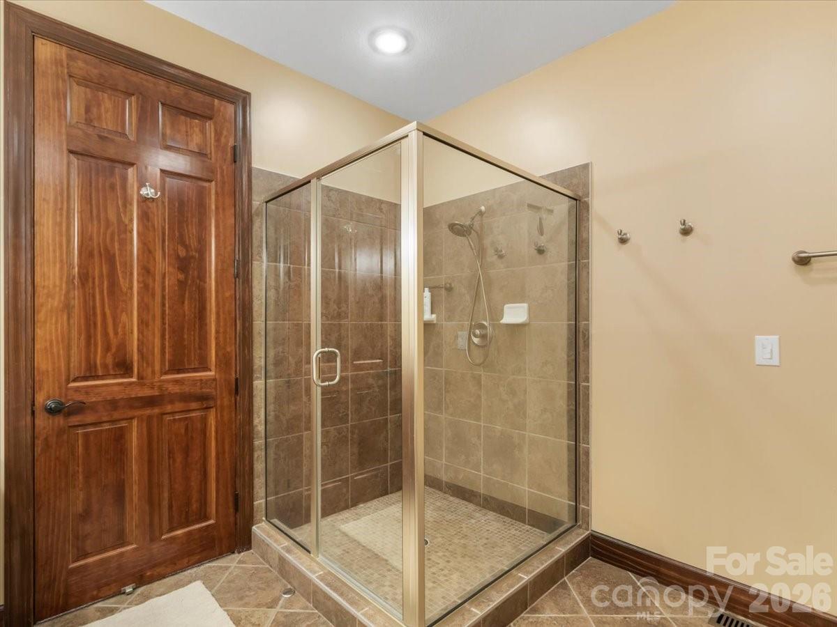 600 Andrew Banks Road, Unit D4 Burnsville, NC 28714 - Photo 38 of 42 a bathroom with a glass shower door