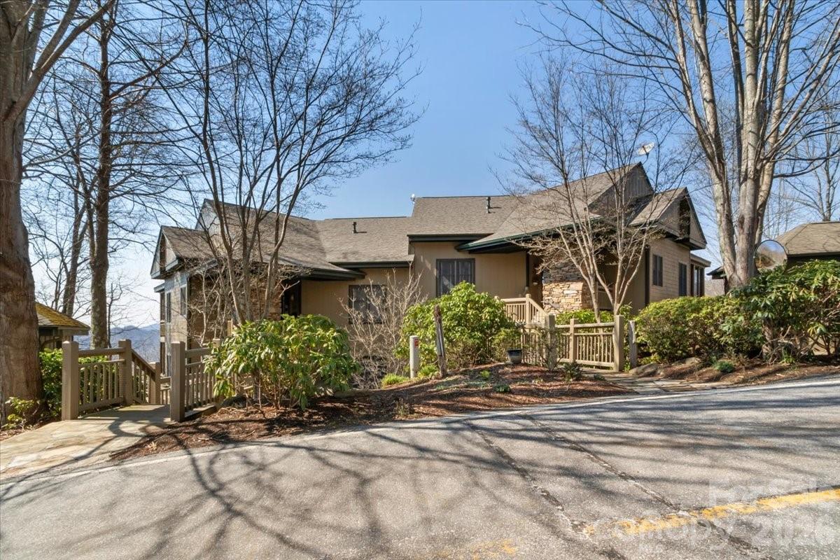 600 Andrew Banks Road, Unit D4 Burnsville, NC 28714 - Photo 41 of 42 a front view of a house with garden